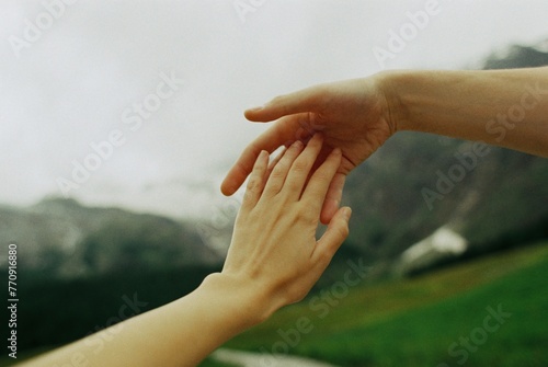 Romantic photo of hands touching photo