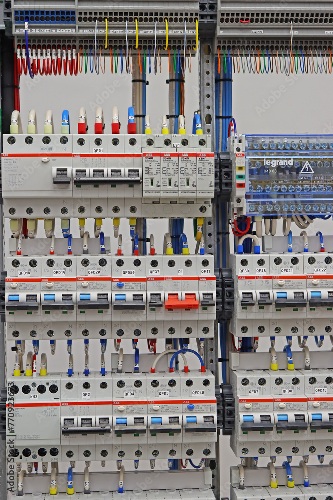 Electric current circuit breakers to protect loads in an electrical distribution cabinet.