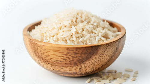 Wooden bowl filled with white rice, a staple food, on a white background