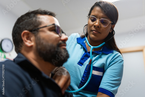 female doctor treating a patient photo