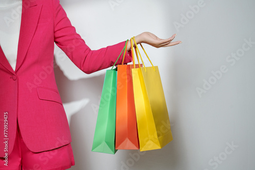 unrecognizable shopaholic woman carrying purchases photo
