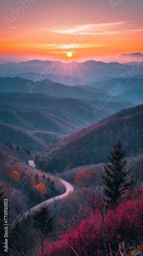 Sun Setting Over Distant Mountains