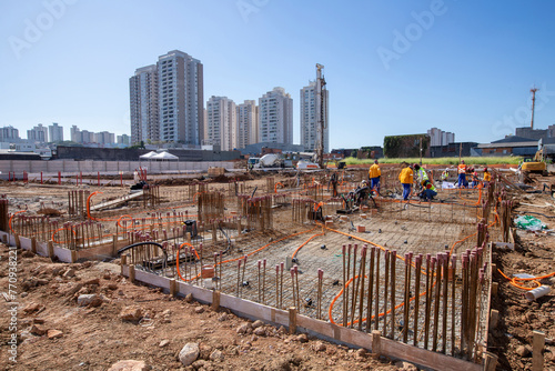 Construction workers during installation of steel gratings for the foundation of a building. Sao Paulo, Brazil