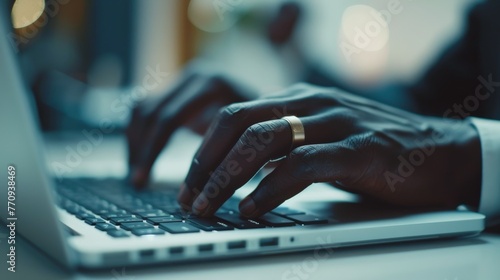 Person Typing on Laptop at Desk