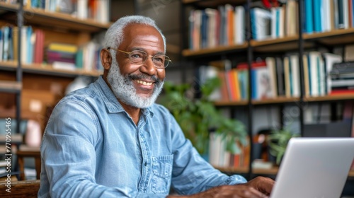 Man Sitting on Couch Using Laptop