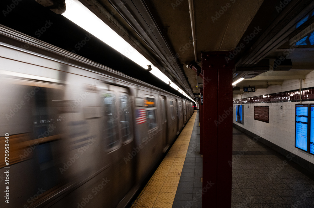 Speeding subway train in Manhattan station Speeding subway train in Manhattan station