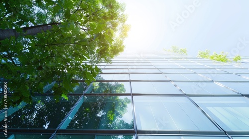 Sustainable green building. Eco-friendly building in modern city. ESG. Sustainable glass office building with green tree. Office with green environment. Corporate sustainability. Net zero emission