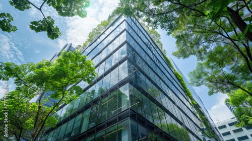 Sustainable green building. Eco-friendly building in modern city. ESG. Sustainable glass office building with green tree. Office with green environment. Corporate sustainability. Net zero emission