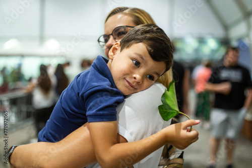 mother with little son at a fair photo