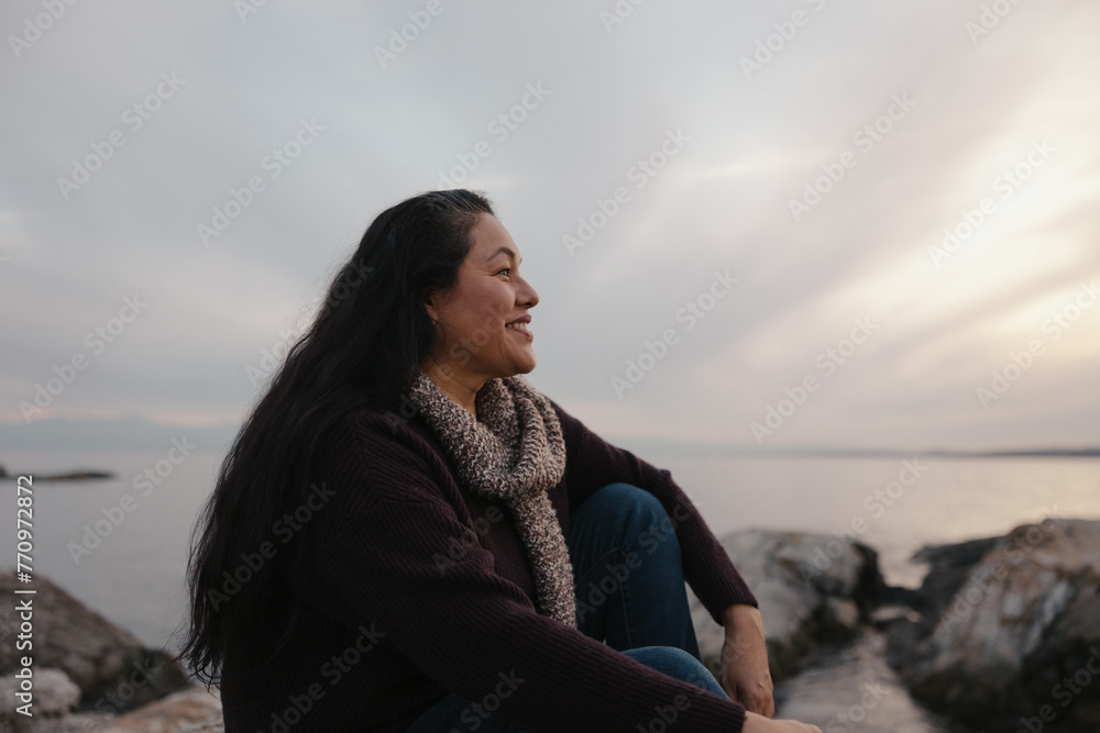 Women sitting outside and smiling. Women sitting outside and smiling.