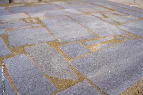 Mosaic background. Gray abstract pattern handmade ceramic tiles on the floor