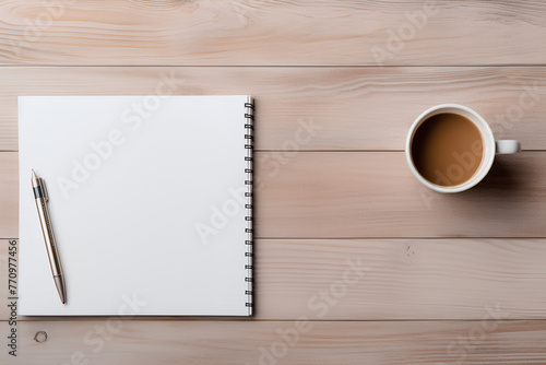Top views workplace background with a cap of coffee, pen, notebook, wood table