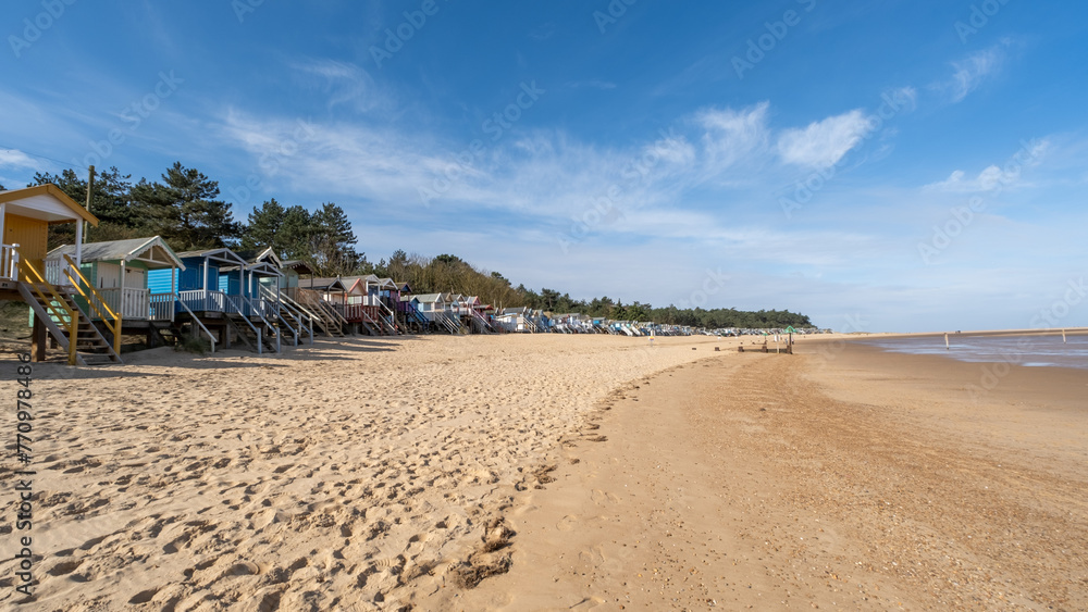 raditional wooden beach huts on the sand in Wells on the North Norfolk coast