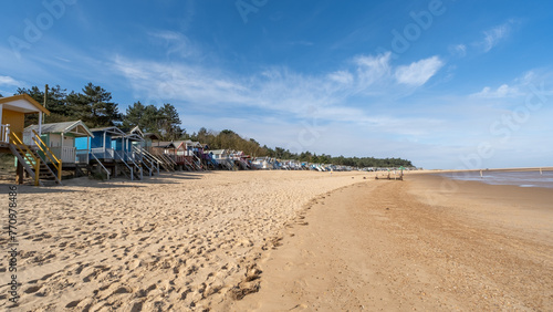 raditional wooden beach huts on the sand in Wells on the North Norfolk coast