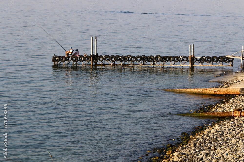A pier on the shore for mooring boats and yachts.