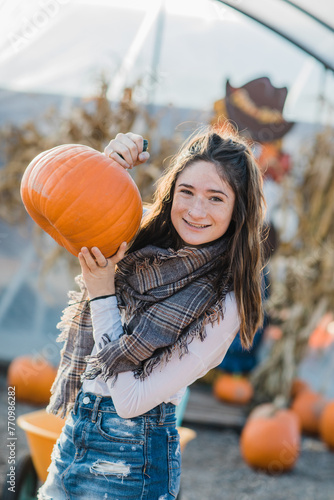 Teen with pumpkin