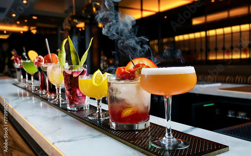 A variety of cocktails are displayed on the restaurant s counter bar photo