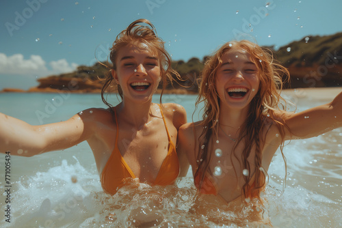Two young women having fun in sea, swimwear, young adult, joy
