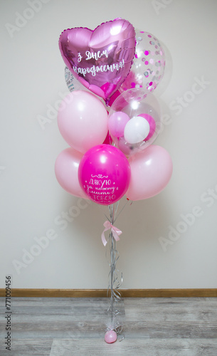bunch of pink helium balloons for birthday