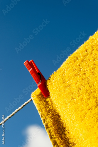  A Vibrant Yellow Towel Drying on a Clothes Line