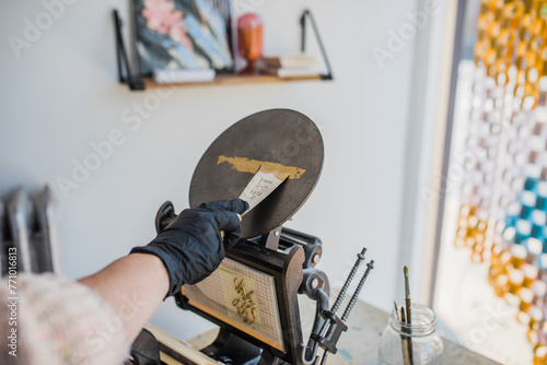 a person working a letterpress