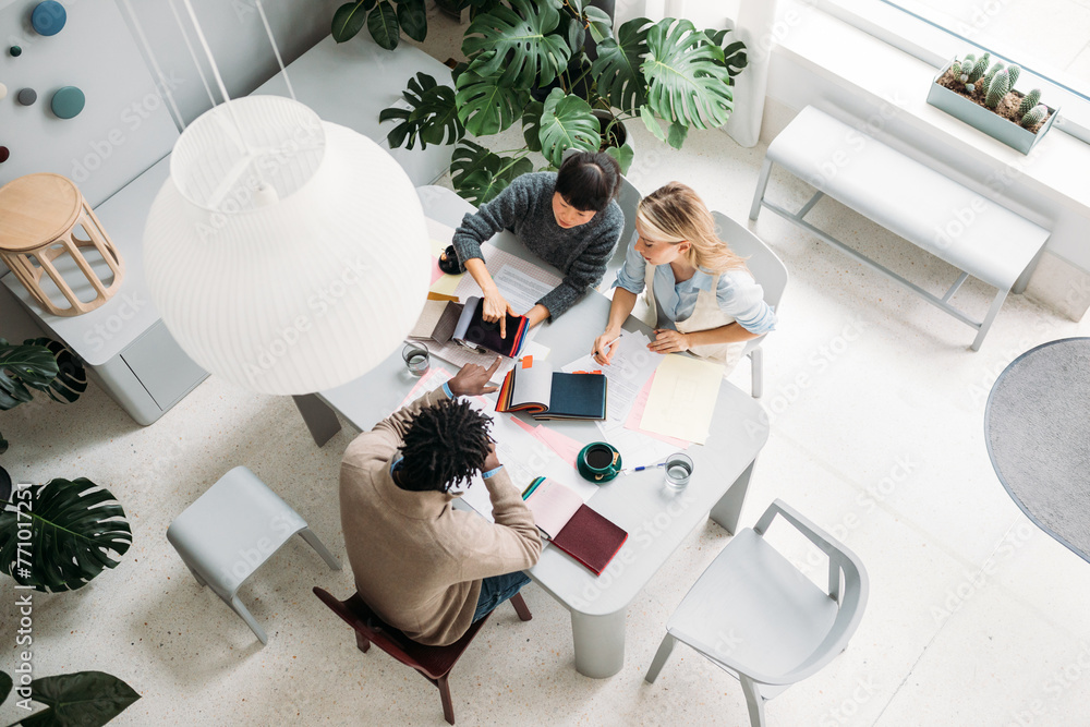 © Studio Firma/Stocksy - Women choosing fabric with client © Studio Firma/Stocksy - Women choosing fabric with client