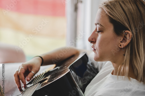 Modern girl playing guitar