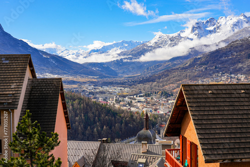 Aerial view of the valley of Briançon overlooked by snow-capped mountains in the French Alps photo