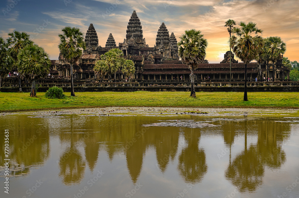 Angkor Wat Temple Complex reflected in the lake at Sunrise - UNESCO World Heritage 12th century masterpiece of Khmer Architecture built by Suryavarman II at Siem Reap, Cambodia, Asia Angkor Wat Temple Complex reflected in the lake at Sunrise - UNESCO World Heritage 12th century masterpiece of Khmer Architecture built by Suryavarman II at Siem Reap, Cambodia, Asia