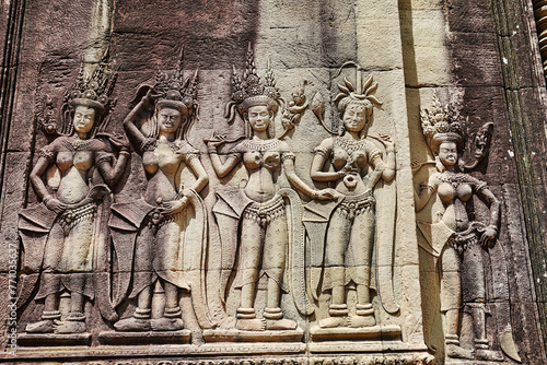 Apsara - Stone bas relief depicting Heavenly nymphs and celestial dancers at the courts of the Gods, carved in stone at Angkor Wat at Siem Reap, Cambodia, Asia