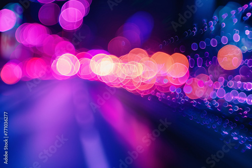 Abstract blurred lights with bokeh effect on a purple background