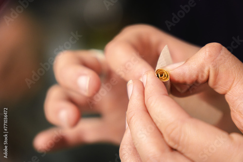 Woman rolling a joint photo