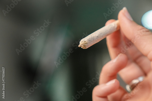 Woman holding a joint