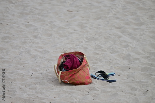 An abandoned bag with personal belongings at the beach of Benidorm-Spain. 