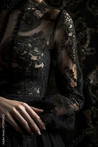 person is wearing a detailed, elegant black lace garment, showcasing intricate designs and patterns, exuding sophistication and luxury
