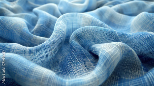 Textured blue plaid fabric with graceful pleats, lying in a wavy layer