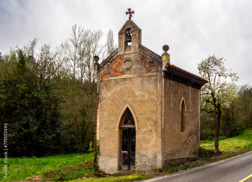 Small and picturesque hermitage of San Ramón, next to the road in the village of Espinedo. Salas, Asturias, Spain.