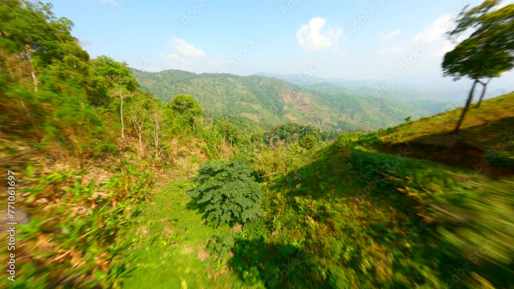 Scenic FPV flight over the hills of a coffee plantation in Chiang Rai, Thailand. Scenic FPV flight over the hills of a coffee plantation in Chiang Rai, Thailand.