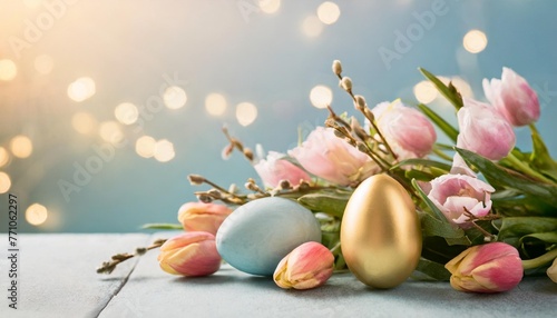 spring flowers and colorful easter egg with pastel blue background