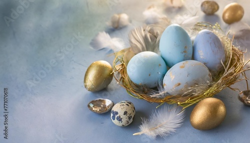 beautiful group ombre blue easter eggs with quail eggs and feathers on a blue background easter concept border eggs copy space for text