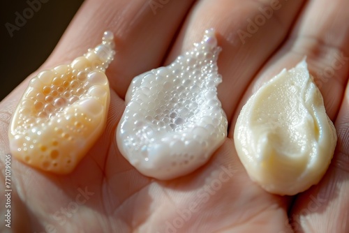 In a palm, skincare products with varying textures, highlighting the beauty and care routine. close-up image of the back of a person's hand with four different types of lotion or cream