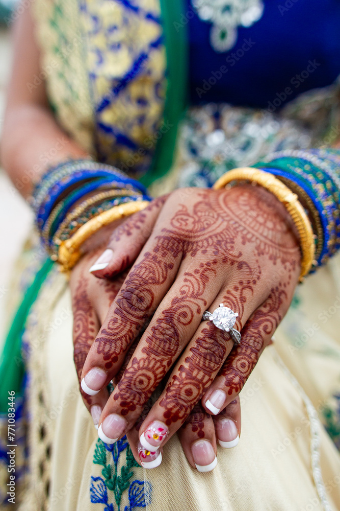 Close up bridal henna tattoo and diamond ring
