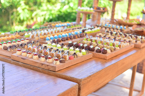 sweets, sweets on a wooden table, sweets on a wooden background, assorted sweets, party sweets, sweets table, sweets display, sweets showcase, sweet shop, daytime party, shop 