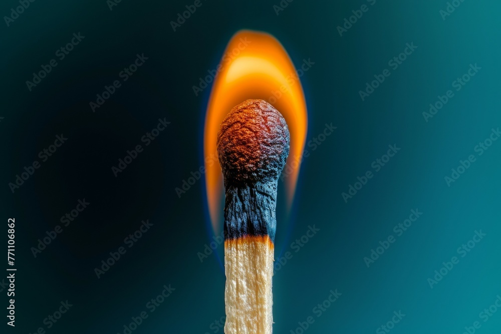 A matchstick is lit and the flame is yellow A matchstick is lit and the flame is yellow