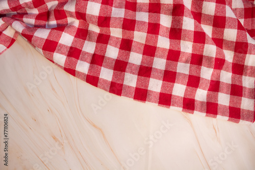 Red and white checkered tablecloth on top, on pink marble surface, space for text or product