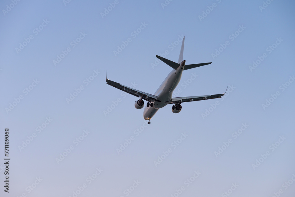 Airplane in the air and sunset in background Airplane in the air and sunset in background