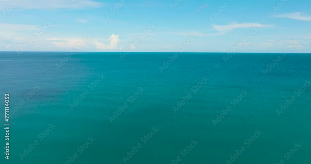Top view of blue ocean with waves and sky with clouds. Borneo, Malaysia. Top view of blue ocean with waves and sky with clouds. Borneo, Malaysia.