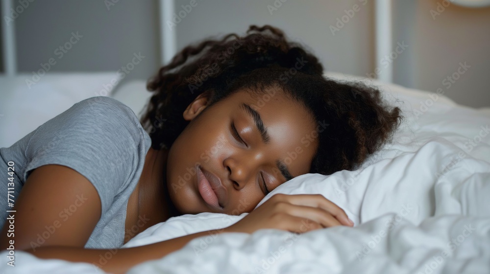 Close up of a pretty black woman with curly hair sleeping in bed, sweet dreams, eyes closed, copy space. Close up of a pretty black woman with curly hair sleeping in bed, sweet dreams, eyes closed, copy space.