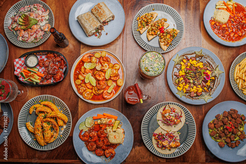 mesa de comida con mariscos y camarones estilo mazatlan sinaloa photo