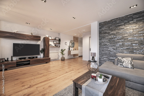 Living room with coffee table and corner sofa upholstered in gray fabric, shaggy rug, side tables, decorative bjeots, wooden floors and a large dark wood bookcase with flat TV